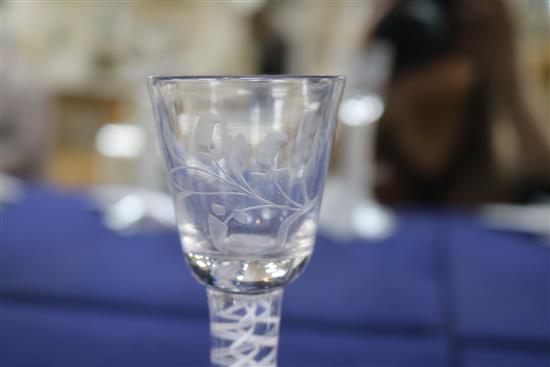 A wine glass, c.1770, with bucket bowl etched with floral sprigs, multi series opaque twist stem, 5.5in.